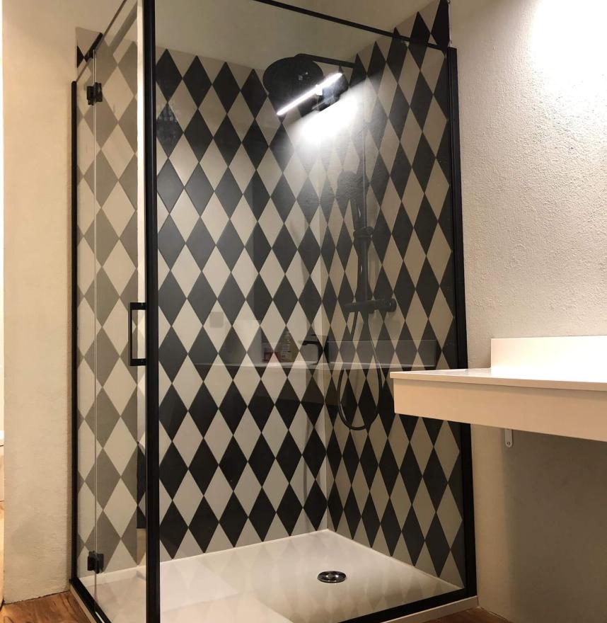 Shower cabin with black furniture