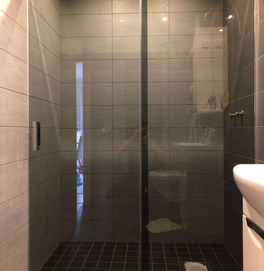 Shower wall with sliding door