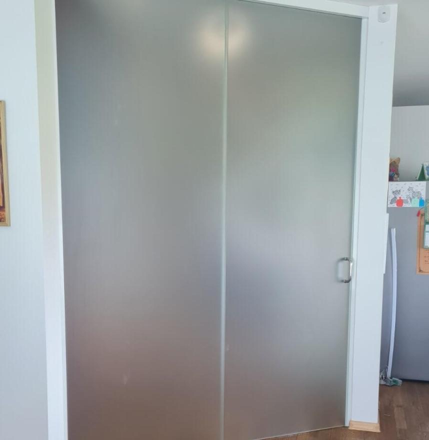Sliding door with white profiles